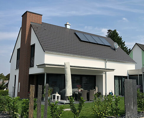 Rost-Wohnbau Energiesparhaus Immobilie Einfamilienhaus mit Terasse und Garten