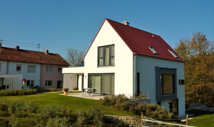 Rost-Wohnbau Einfamilienhaus Energiesparhaus Eigentumswohnungen mit Garten