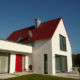 Rost-Wohnbau Energiesparhaus Immobilie Mehrfamilienhaus mit Terasse und Garten