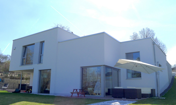 Rost-Wohnbau Einfamilienhaus Energiesparhaus Eigentumswohnungen mit Garten und Terrasse