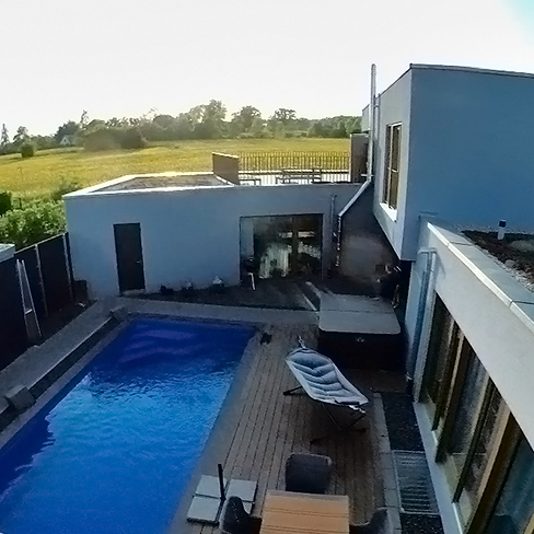 Rost-Wohnbau Einfamilienhaus Energiesparhaus mit Pool und Dachterrasse
