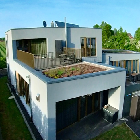 Rost-Wohnbau Einfamilienhaus Energiesparhaus mit Dachterrasse